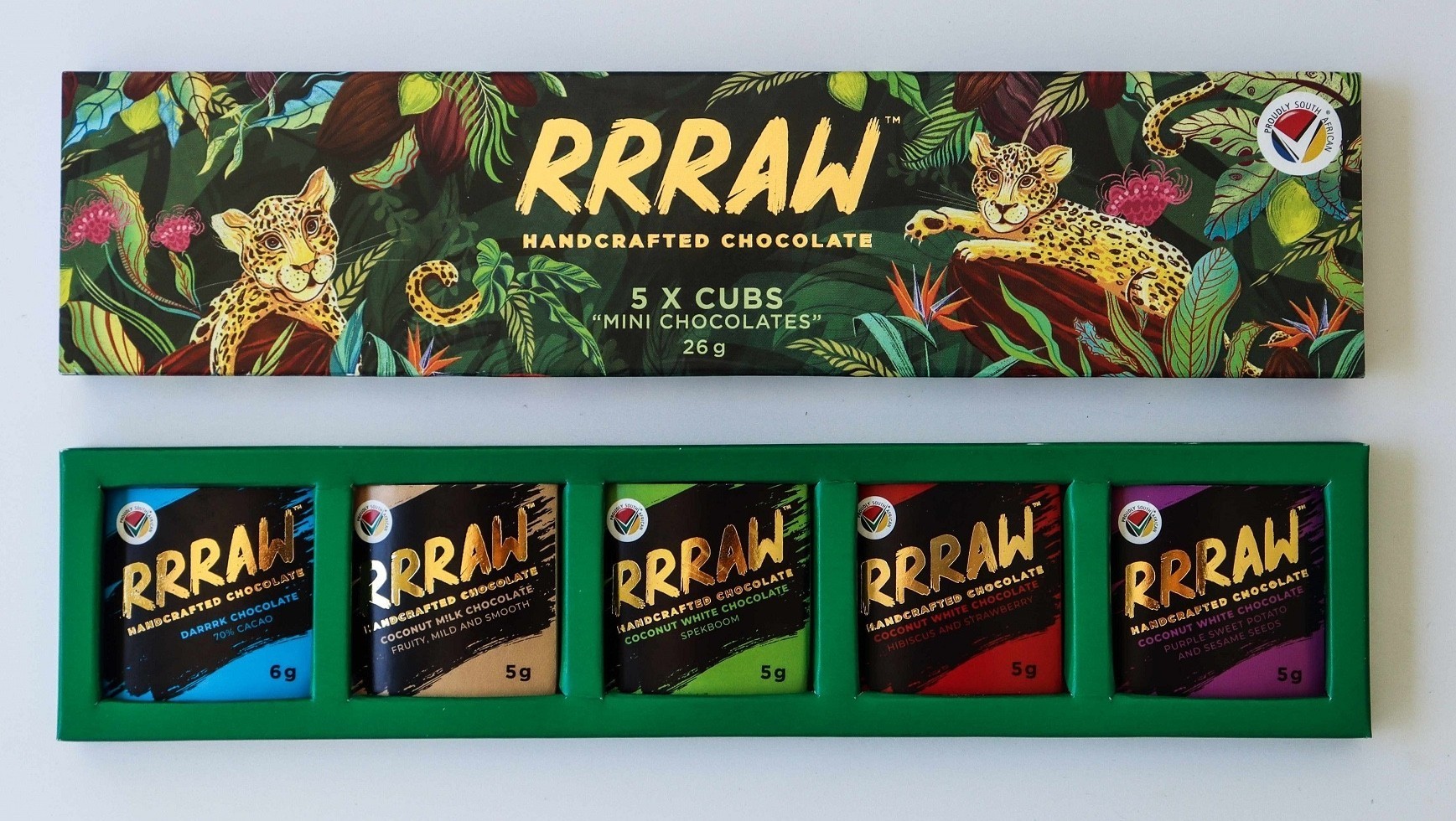 RRRAW leopard cubs hugging cocoa beans in jungles chocolate bars packaging design with little chocolates inside photo